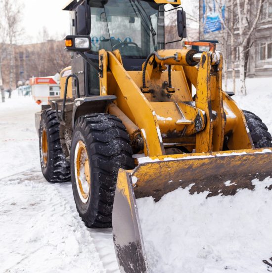 Big,Orange,Tractor,Cleans,Up,Snow,From,The,Road,And